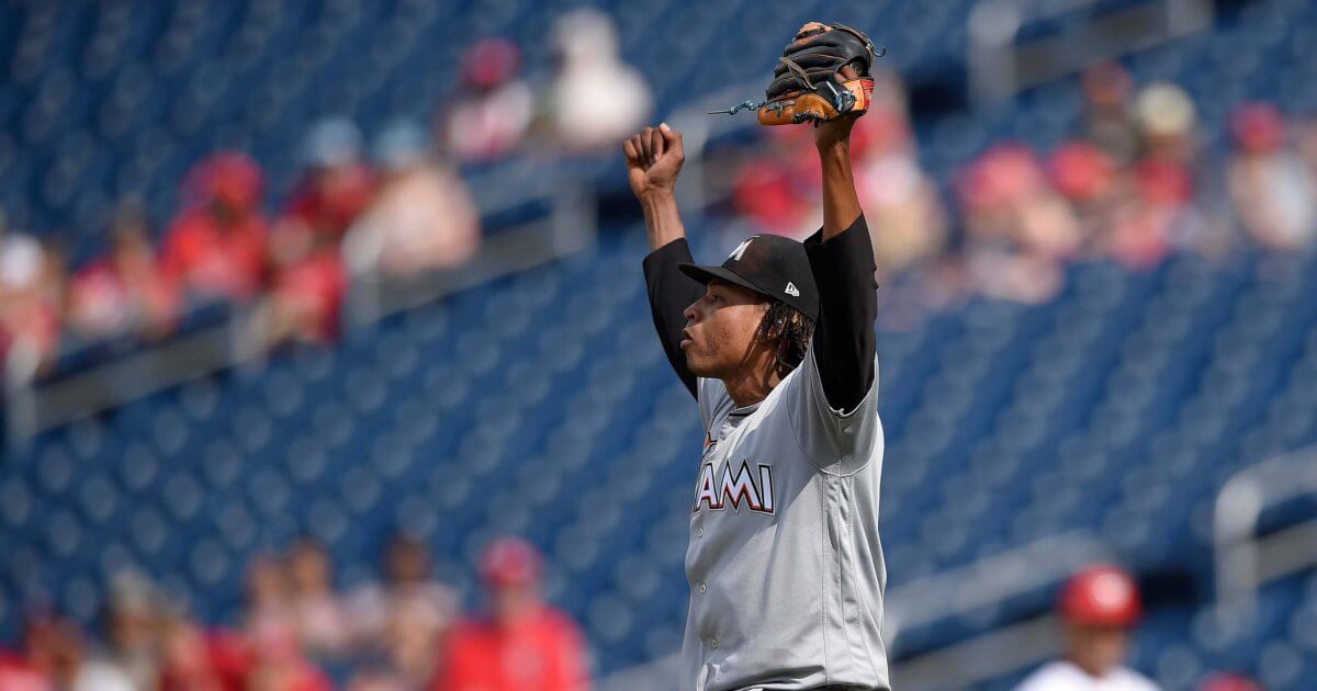 Pitcher with his arms up in victory.