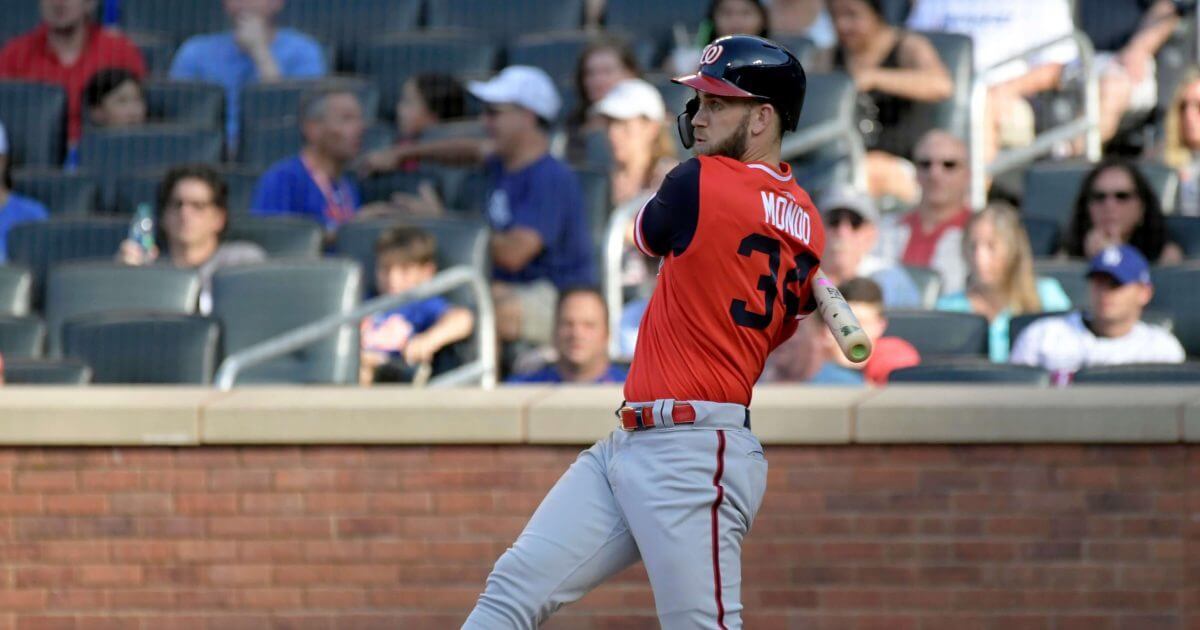 Washington Nationals' Bryce Harper grounds into a double play during the fifth inning of a baseball game against the New York Mets, Saturday, Aug. 25, 2018, in New York.