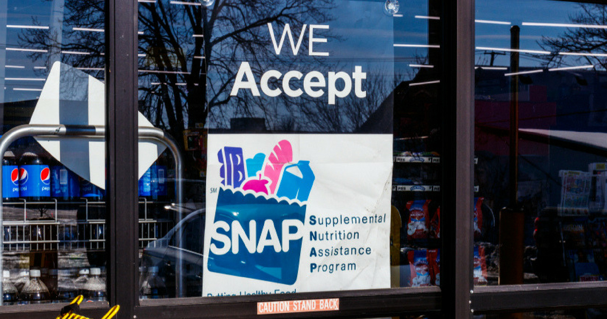 A grocery store in Indiana displays a banner announcing it accepts food stamp benefits