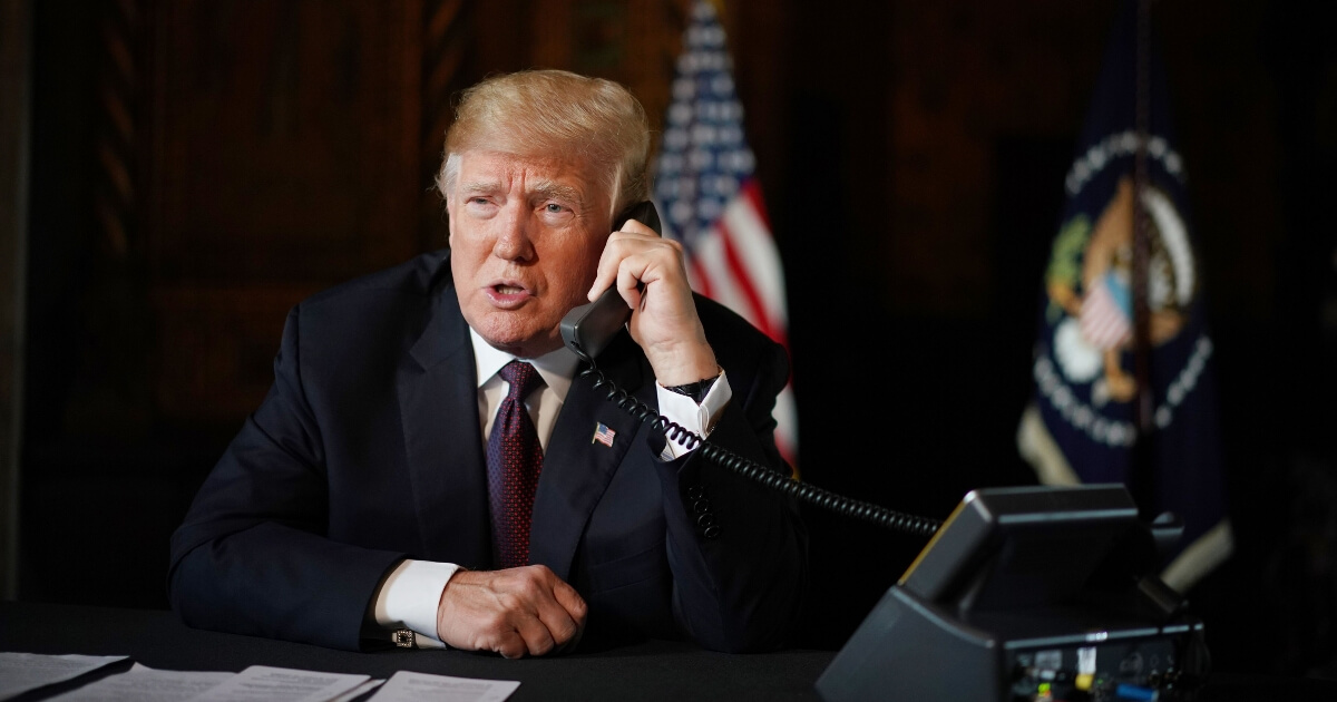 US President Donald Trump speaks to members of the military via teleconference