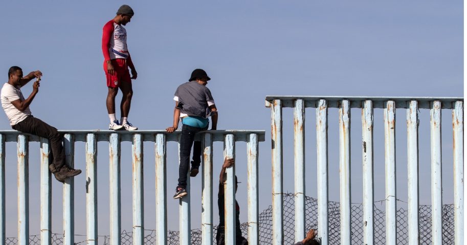 Caravan Hits US-Mexico Border, Members Immediately Start Climbing Fence