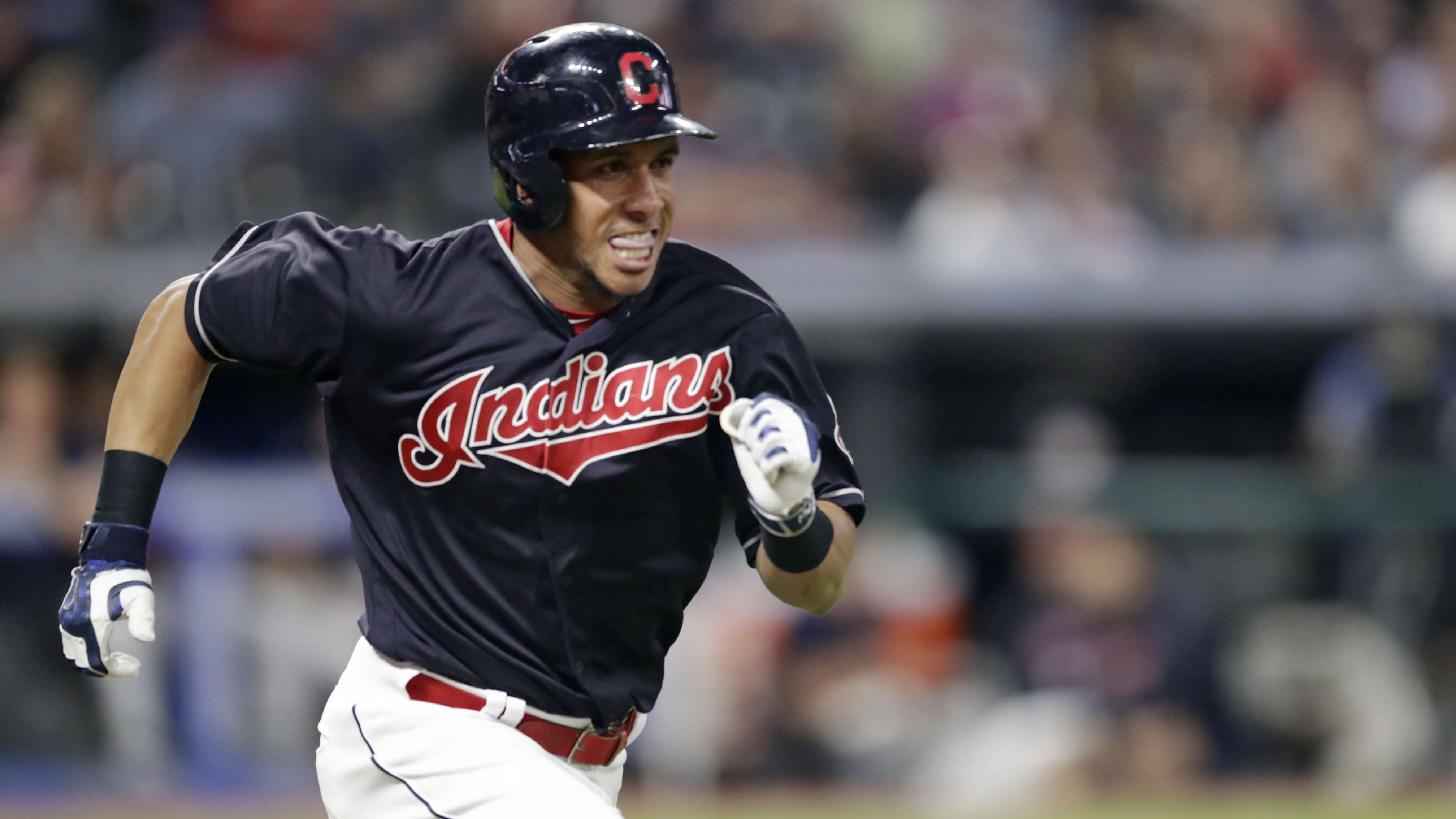 Michael Brantley runs to first base on a passed ball in the Indians' Sept. 19 game against the Chicago White Sox in Cleveland.