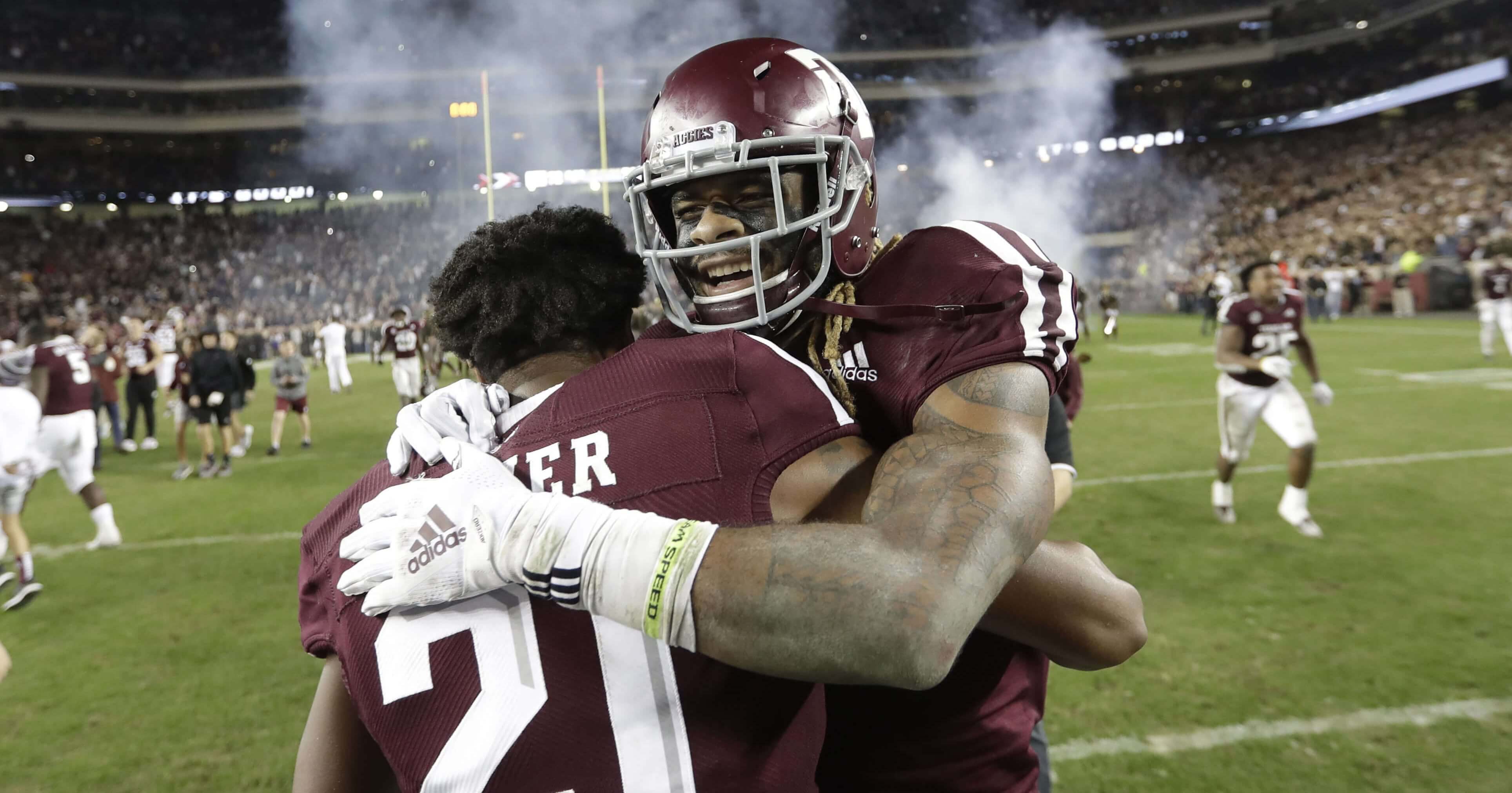 Texas A&M wide receiver Kendrick Rogers, right, celebrates with Charles Oliver after their 74-72 win in seven overtimes against LSU on Nov. 24 in College Station, Texas.