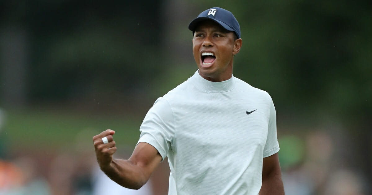 Tiger Woods of the United States celebrates after making a putt for birdie on the 15th green during the second round of the Masters at Augusta National Golf Club on April 12, 2019 in Augusta, Georgia.