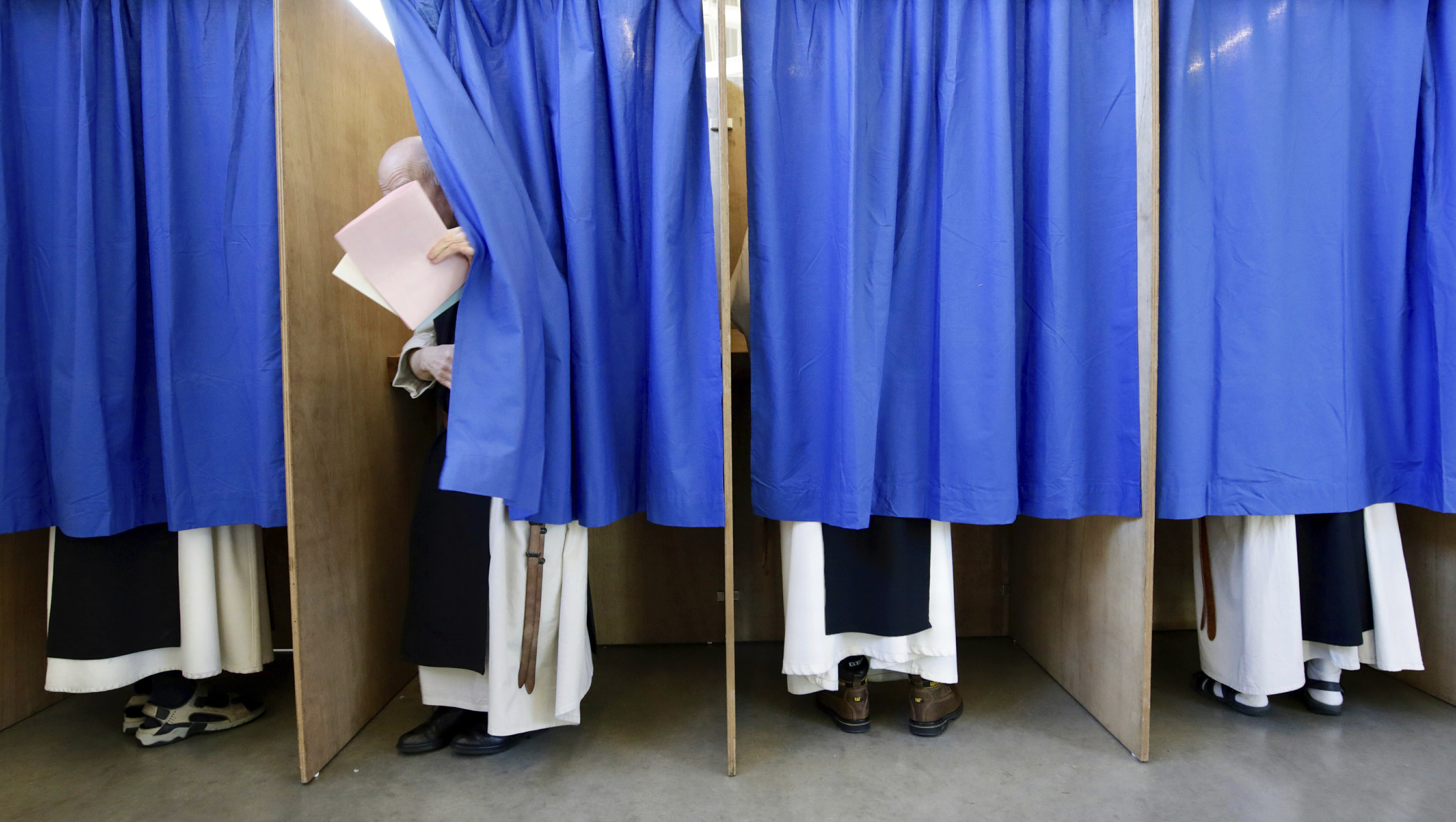 Curtained polling booths.