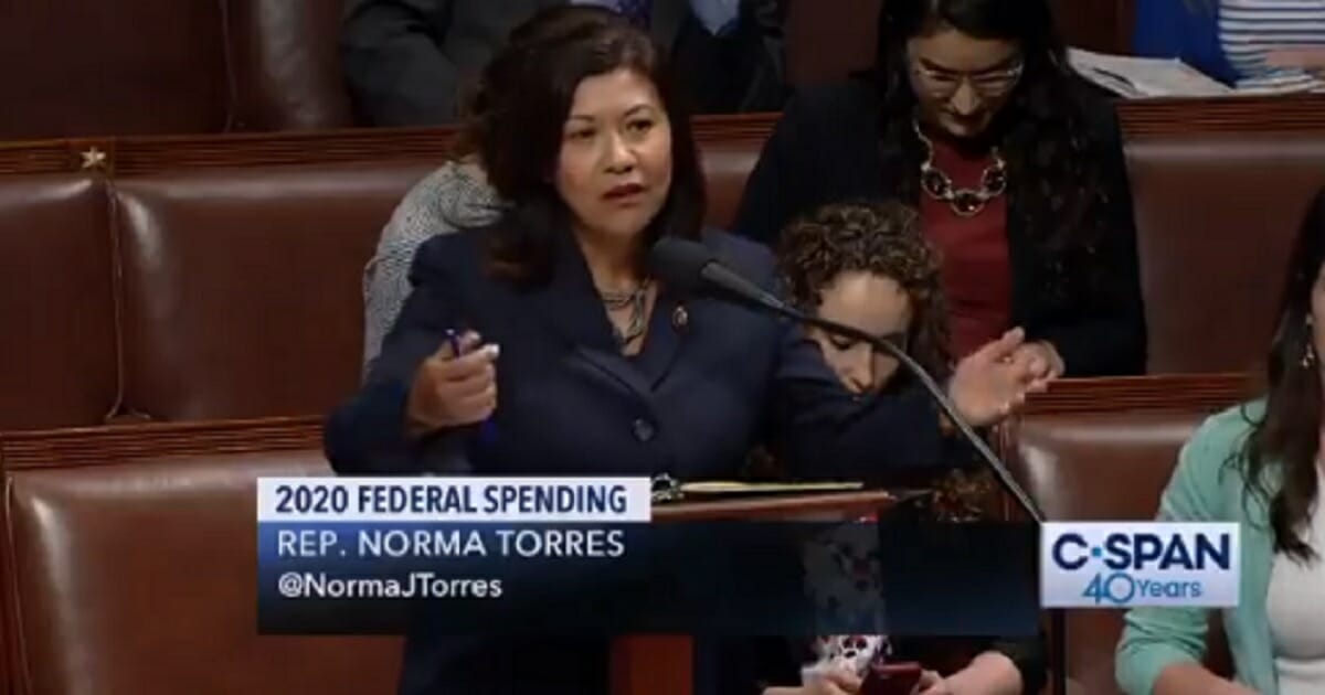 California Democrat Rep. Normal Torres speaks on the House floor on Wednesday.