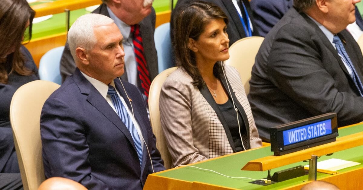 Vice President Mike Pence and then-United Nations Ambassador Nikki Haley listen as President Donald Trump addresses the U.N. in September 2018.