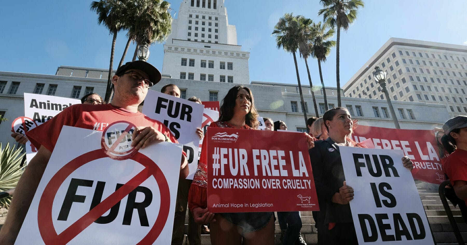 Protesters from PETA hold signs to ban fur outside City Hall in Los Angeles on Sept. 18, 2018.