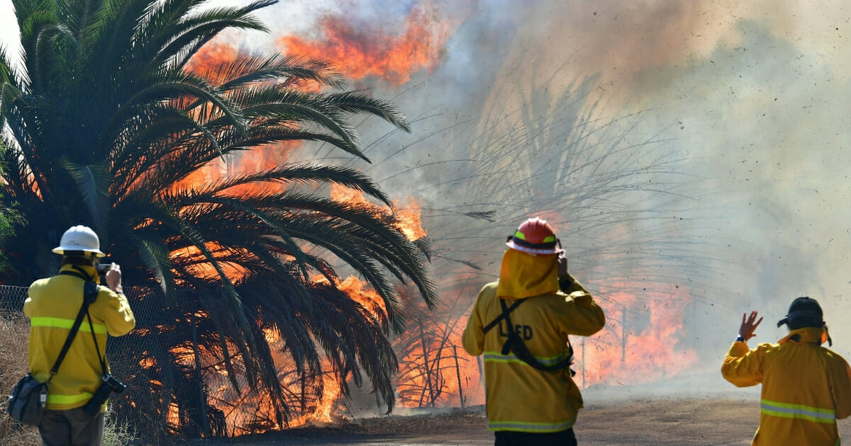Fire erupts near a ranch on Tierra Rejada Road near the Ronald Reagan Presidential Library in Simi Valley, California.