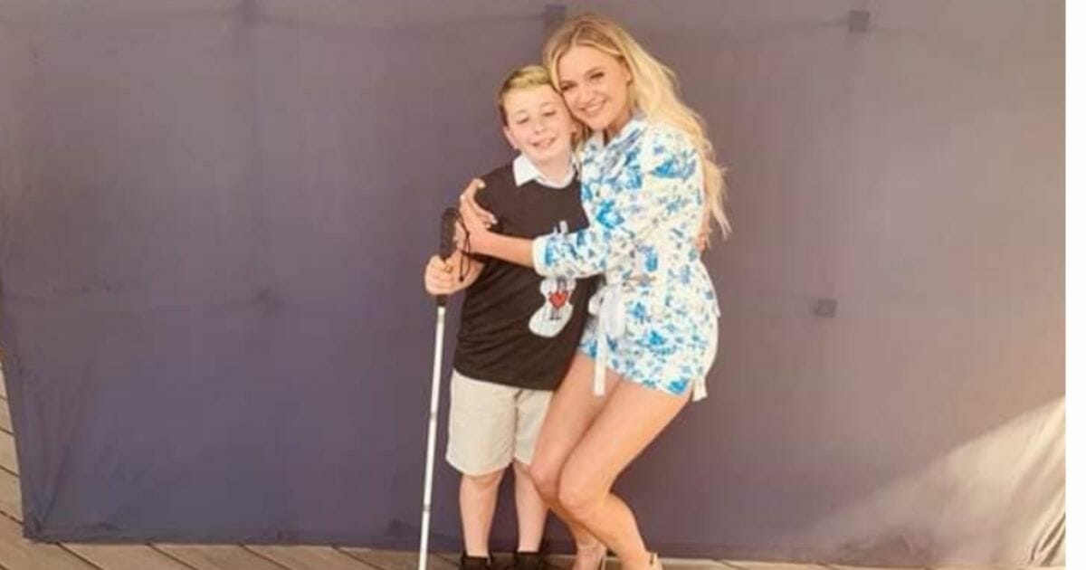 Kelsea Ballerini with Ayden Morgan, a 9-year-old boy battling brain cancer.