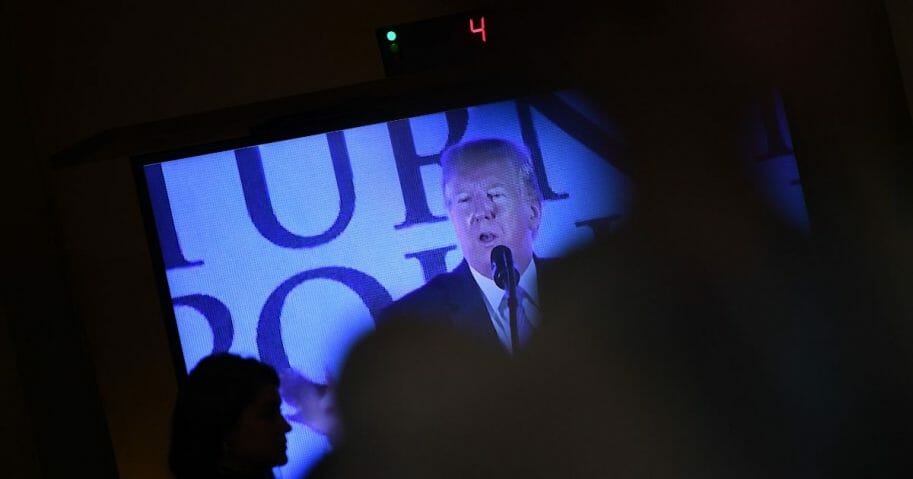 A video screen with U.S. President Donald Trump speaking is seen during a House Judiciary Committee hearing on the impeachment of US President Donald Trump on Capitol Hill in Washington, DC, Dec. 4, 2019.