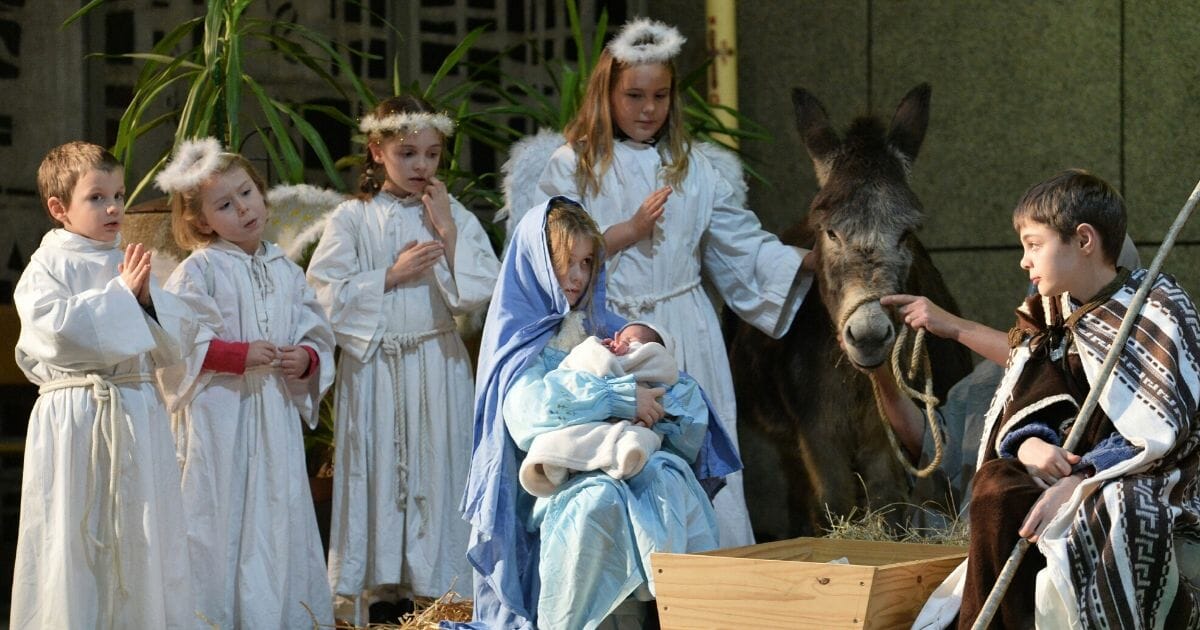Children perform a nativity scene on Christmas Eve at the Saint-Liboire Church in Le Mans, France, on Dec. 24, 2017.
