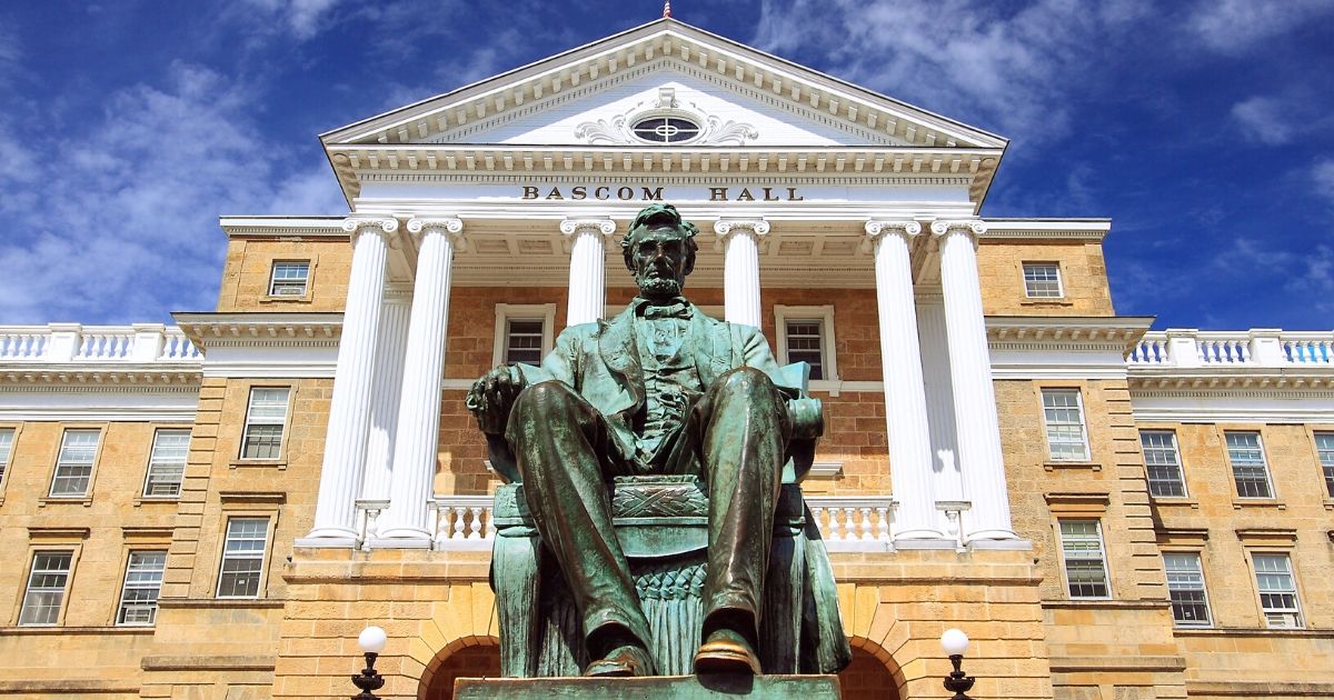 A statue of Abraham Lincoln sits in front of Bascom Hall at the University of Wisconsin, Madison.