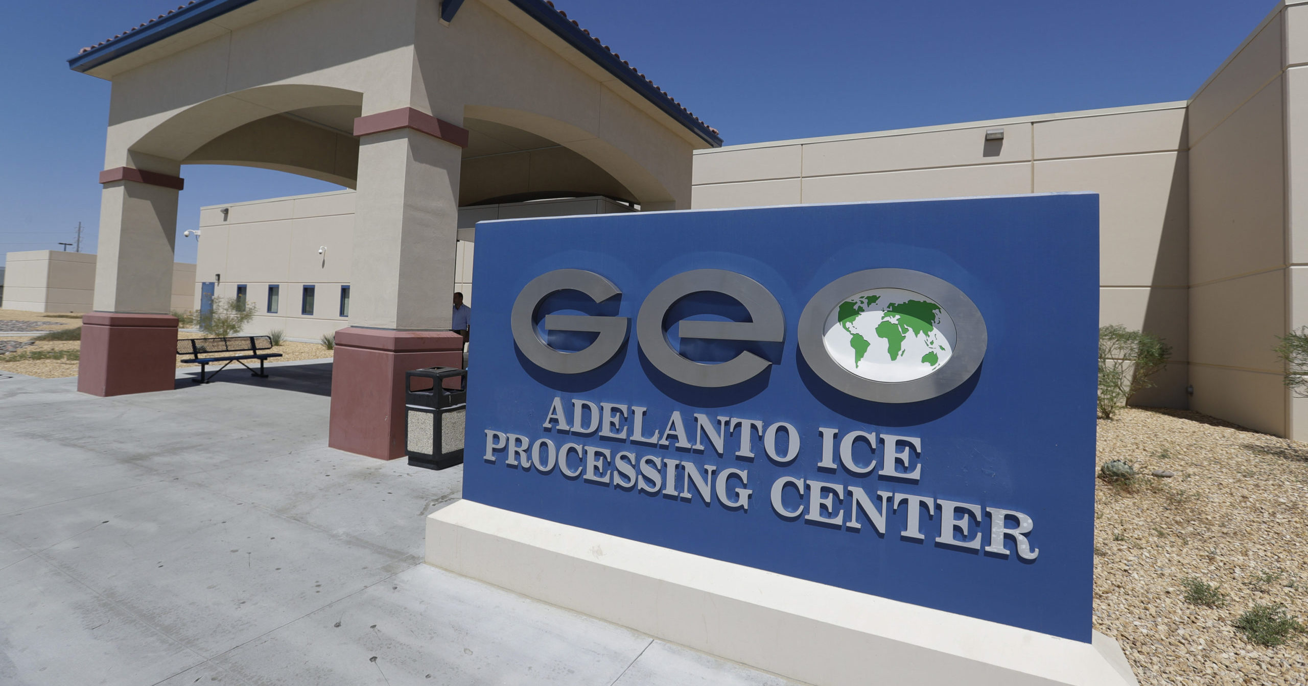This Aug. 28, 2019, file photo shows the Adelanto US Immigration and Enforcement Processing Center operated by GEO Group, a Florida-based company specializing in privatized corrections, in Adelanto, California.