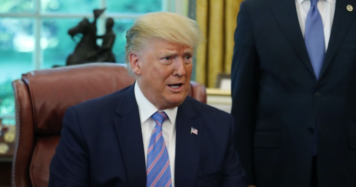 WASHINGTON, DC - JULY 01: US President Donald Trump speaks to the media after signing a bill for border funding in the Oval Office at the White House on July 1, 2019 in Washington, DC.