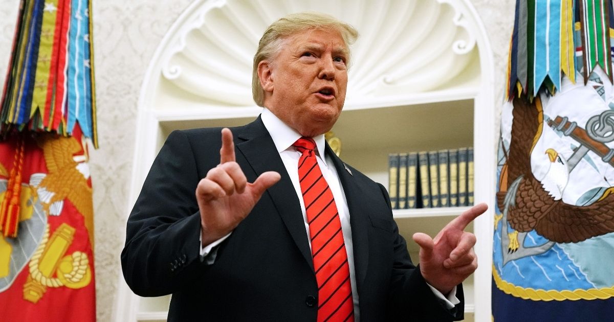 WASHINGTON, DC - SEPTEMBER 30: U.S. President Donald Trump gives pauses to answer a reporters' question about a whistleblower as he leaves the Oval Office after hosting the ceremonial swearing in of Labor Secretary Eugene Scalia at the White House September 30, 2019 in Washington, DC. Scalia was nominated by Trump to lead the Labor Department after Alex Acosta resigned under criticism over a plea deal he reached with Jeffrey Epstein.