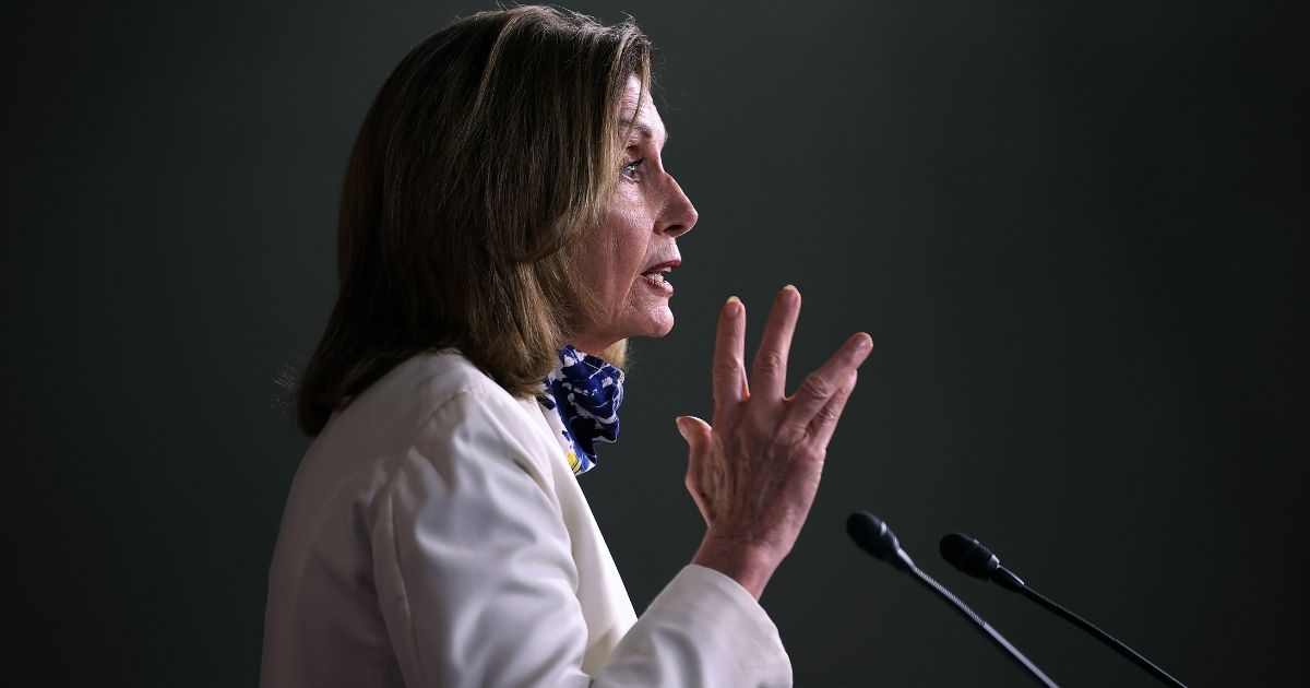 WASHINGTON, DC - OCTOBER 01: Speaker of the House Nancy Pelosi (D-CA) talks to reporters during her weekly news conference in the House Visitors Center at the U.S. Capitol on October 01, 2020 in Washington, DC. Pelosi had a warning for President Donald Trump not to place hope in maneuvers in Congress to help him win the November election. 'Don't cause chaos,' she said. 'Because that light at the end of the tunnel in the House is going to be a train coming right at your plan.'