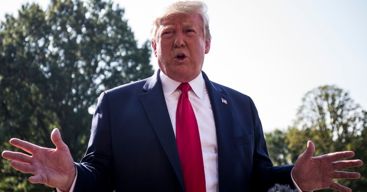 WASHINGTON, DC - AUGUST 07: President Donald Trump speaks to members of the press before departing from the White House en route to Dayton, Ohio and El Paso, Texas on August 7, 2019 in Washington, DC. Trump is will visit the two cities to meet with victims and law enforcement following a pair of deadly shooting attacks last weekend.