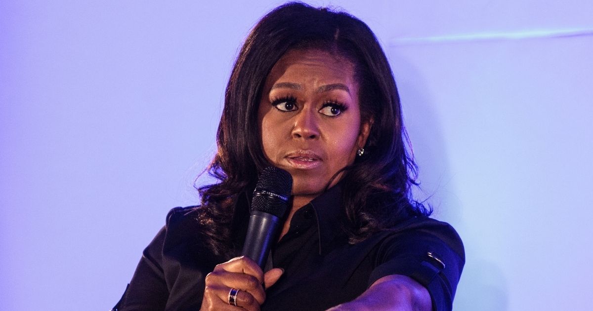 LONDON, ENGLAND - DECEMBER 03: Former U.S. First Lady Michelle Obama speaks at an event at the Elizabeth Garrett Anderson School on December 03, 2018 in London, England. The former First Lady's memoir titled 'Becoming' has become the best selling book in the US of 2018 according to figures released by her publisher Penguin Random House.