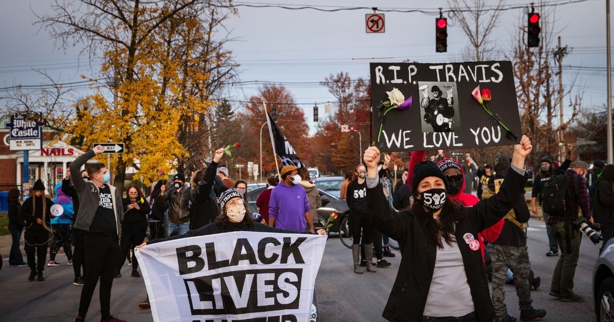 Black Lives Matter demonstrators march in memoriam of Travis Nagdy in Jefferson Square Park on Nov. 23 in Louisville, Kentucky.
