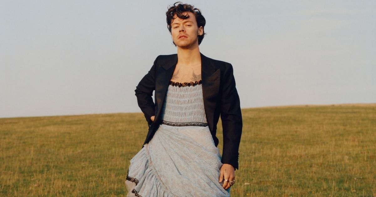 Singer-songwriter Harry Styles poses in a dress for a Vogue photo shoot.