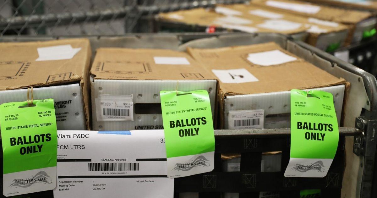 Boxes with ballots are seen at the Miami-Dade County Election Department as the vote-by-mail ballots are placed on to a U.S. Post Office truck to be delivered to voters on Oct. 1, 2020, in Doral, Florida.