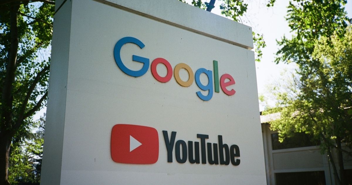 Sign with logos for Google and the Google owned video streaming service YouTube at the Googleplex, the Silicon Valley headquarters of search engine and technology company Google Inc in Mountain View, California, April 14, 2018.