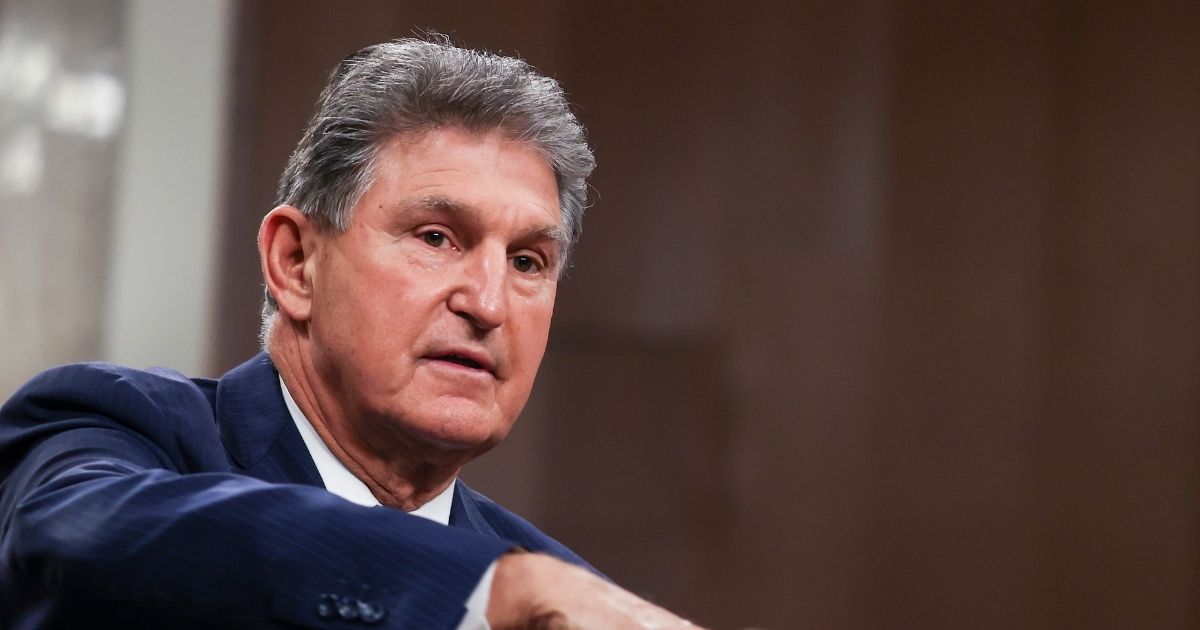 Democratic Sen. Joe Manchin of West Virginia speaks alongside a bipartisan group of Democratic and Republican members of Congress as they announce a proposal for a COVID-19 relief bill on Capitol Hill on Dec. 14, 2020, in Washington, D.C.