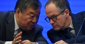 China's Liang Wannian, left, talks with Peter Ben Embarek of the World Health Organization during a news conference Tuesday following a visit by WHO experts to the city of Wuhan in China's Hubei province.