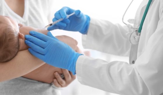 A baby is pictured receiving a vaccine in the stock image above.