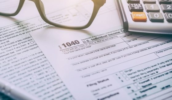 An IRS Form 1040 is pictured in the stock image above.