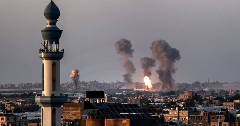 Smoke and fire rise above buildings in Khan Yunis in the southern Gaza Strip, during an Israeli air strike in response to rocket attacks, on Wednesday.