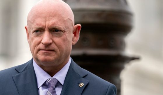 Democratic Arizona Sen. Mark Kelly listens during a news conference outside the U.S. Capitol on April 29 in Washington, D.C.