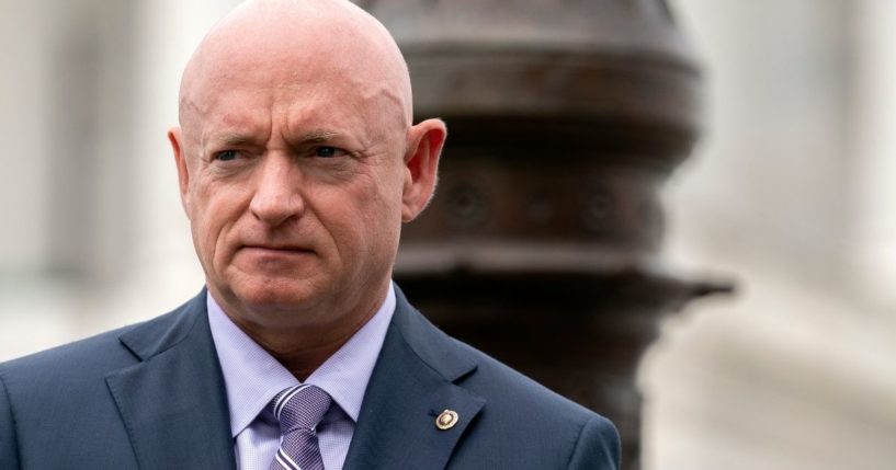 Democratic Arizona Sen. Mark Kelly listens during a news conference outside the U.S. Capitol on April 29 in Washington, D.C.