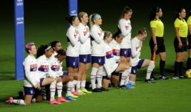 United States players kneel for the American national anthem during the SheBelieves Cup at Exploria Stadium on February 18, in Orlando, Florida.