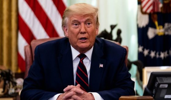 Then-President Donald Trump participates in a signing ceremony in the Oval Office of the White House in Washington on Sept. 4.