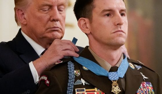 Then-President Donald Trump presents the Medal of Honor to Sergeant Major Thomas P. Payne, United States Army, for conspicuous gallantry in the East Room of the White House on Sept. 11, 2020, in Washington.