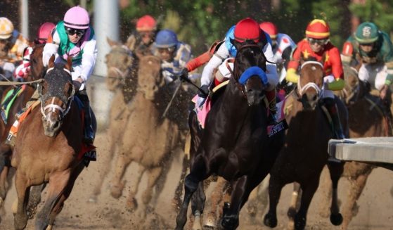 Medina Spirit leads the field on the way to victory in the May 1 Kentucky Derby.