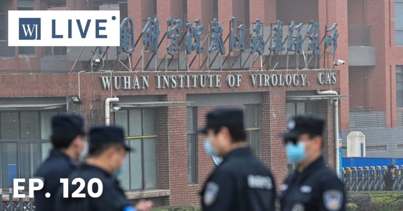 Security personnel stand guard outside the Wuhan Institute of Virology in Wuhan as members of the World Health Organization team investigating the origins of the COVID-19 coronavirus make a visit to the institute in Wuhan in China's central Hubei province on Feb. 3, 2021.