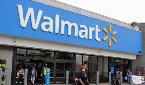 In this image for the Howard Center for Investigative Journalism at the University of Maryland's Philip Merrill College of Journalism, shoppers walk out of a Walmart store in Waldorf, Maryland, on May 7.