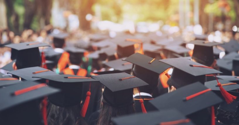 College graduates are seen in this stock image.