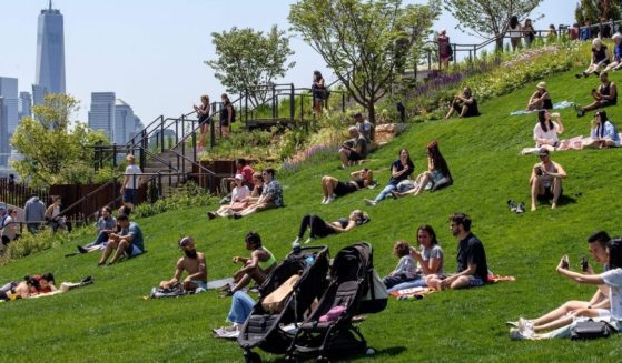 People visit Hudson River Park on Friday in New York City.