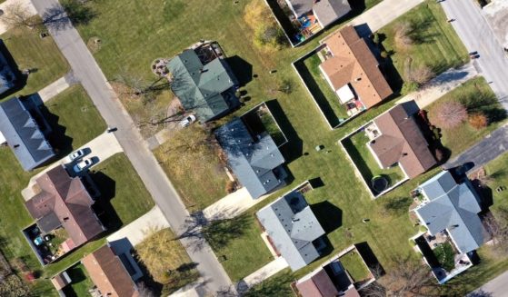 This stock image shows an overhead view of a block of houses.