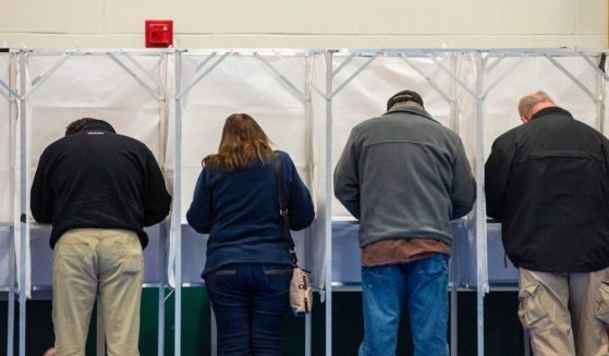 Voters fill out their ballots at the Captain Samuel Douglass Academy in Brookline, New Hampshire, on Nov. 3, 2020.