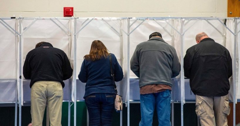 Voters fill out their ballots at the Captain Samuel Douglass Academy in Brookline, New Hampshire, on Nov. 3, 2020.