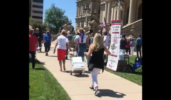 Women bring affadavits alleging voter fraud to the Michigan Secretary of State's Office.