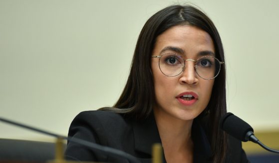 New York Democratic Rep. Alexandria Ocasio-Cortez listens as Facebook Chairman and CEO Mark Zuckerberg testifies before the House Financial Services Committee in Washington, D.C., on Oct. 23, 2019.