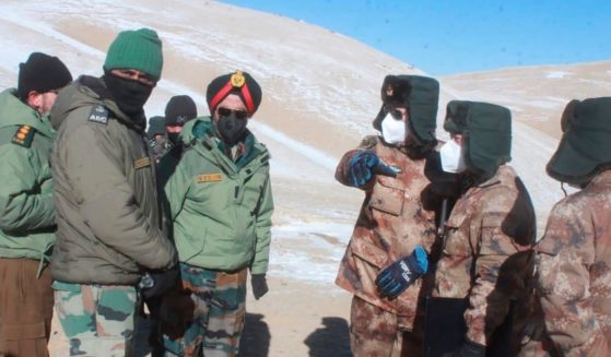 In this photograph provided by the Indian Army, army officers of India and China hold a meeting at Pangong lake region in Ladakh on the India-China border on Feb. 10, 2021.