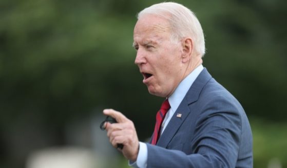 President Joe Biden gestures to reporters as he returns to the White House on Thursday in Washington, D.C.