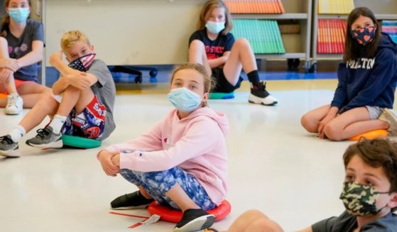 Fifth-graders wear face masks and are socially distanced during a music class at Milton Elementary School in Rye, New York, on May 18.